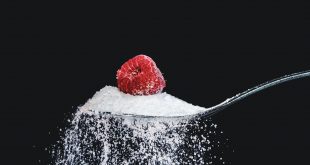 Spoonful of sugar with a raspberry on top