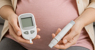 Pregnant woman managing gestational diabetes with a glucose meter and medical guidance.
