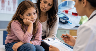 Young girl with her mother during a medical consultation as a doctor reviews symptoms and glucose testing for possible type 1 diabetes.